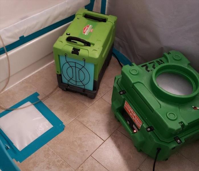 Two dehumidifiers in a bathroom