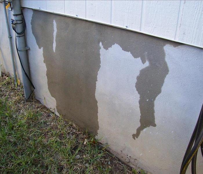 water dripping down the side of a wall